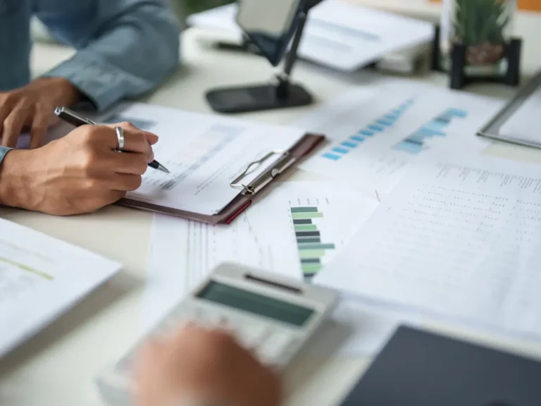 A man doing manual accounting tasks