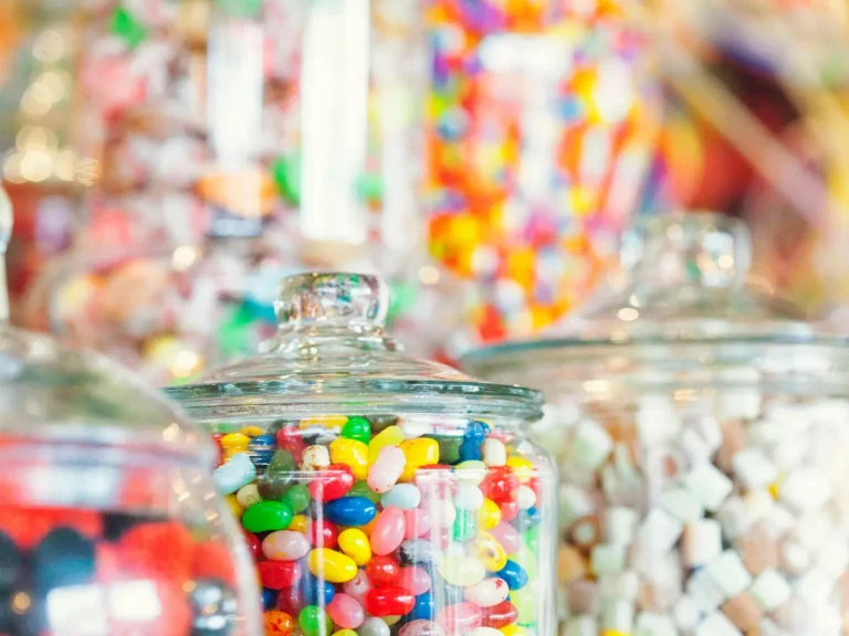 A row of glasses with different candy in them, representing different subscription business models.