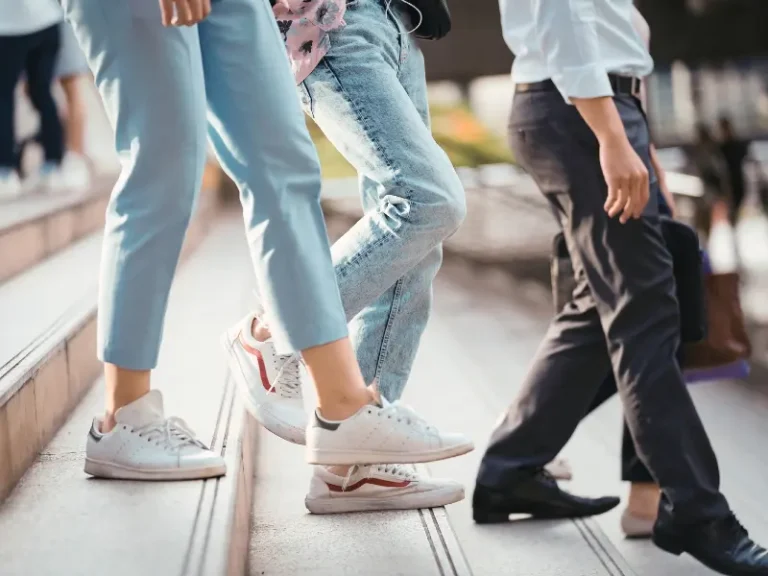 People walk down stair steps.