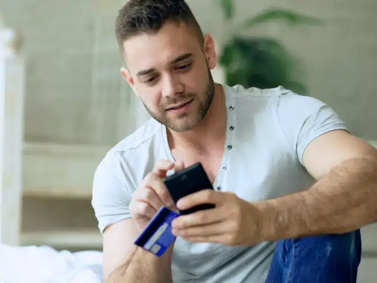 A man is online shopping with click to pay options