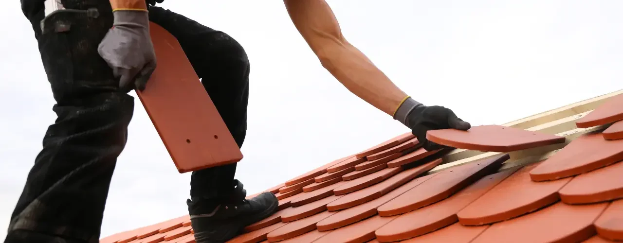 A person renovates a roof.