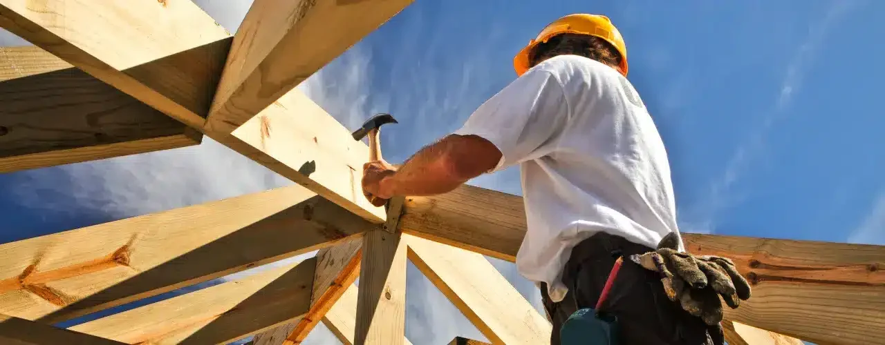 A builder working on a house