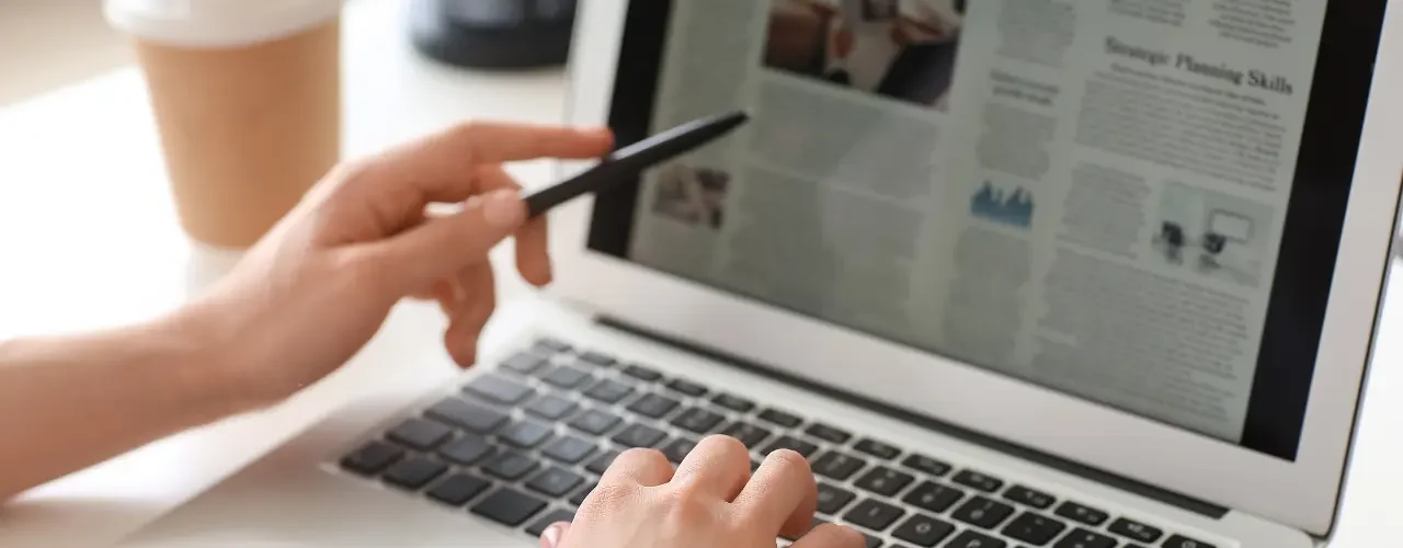 A person is reading a newspaper online.