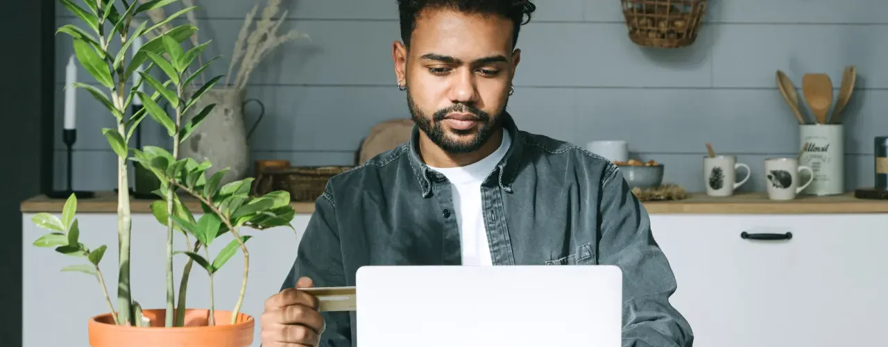 A young man is online shopping